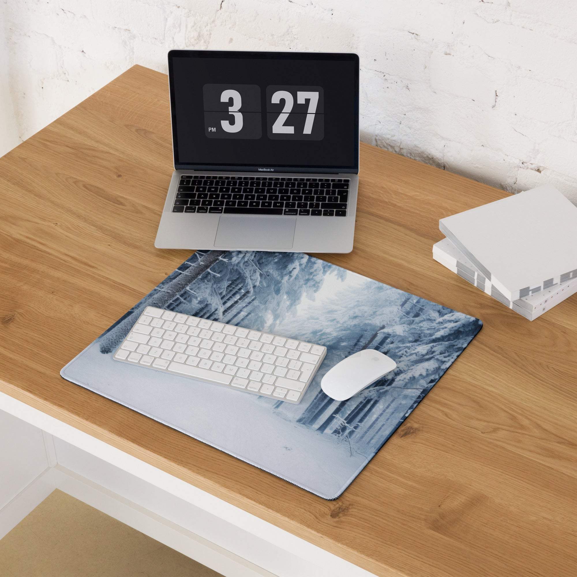 Blue and white winter forest gaming mousepad with textured surface