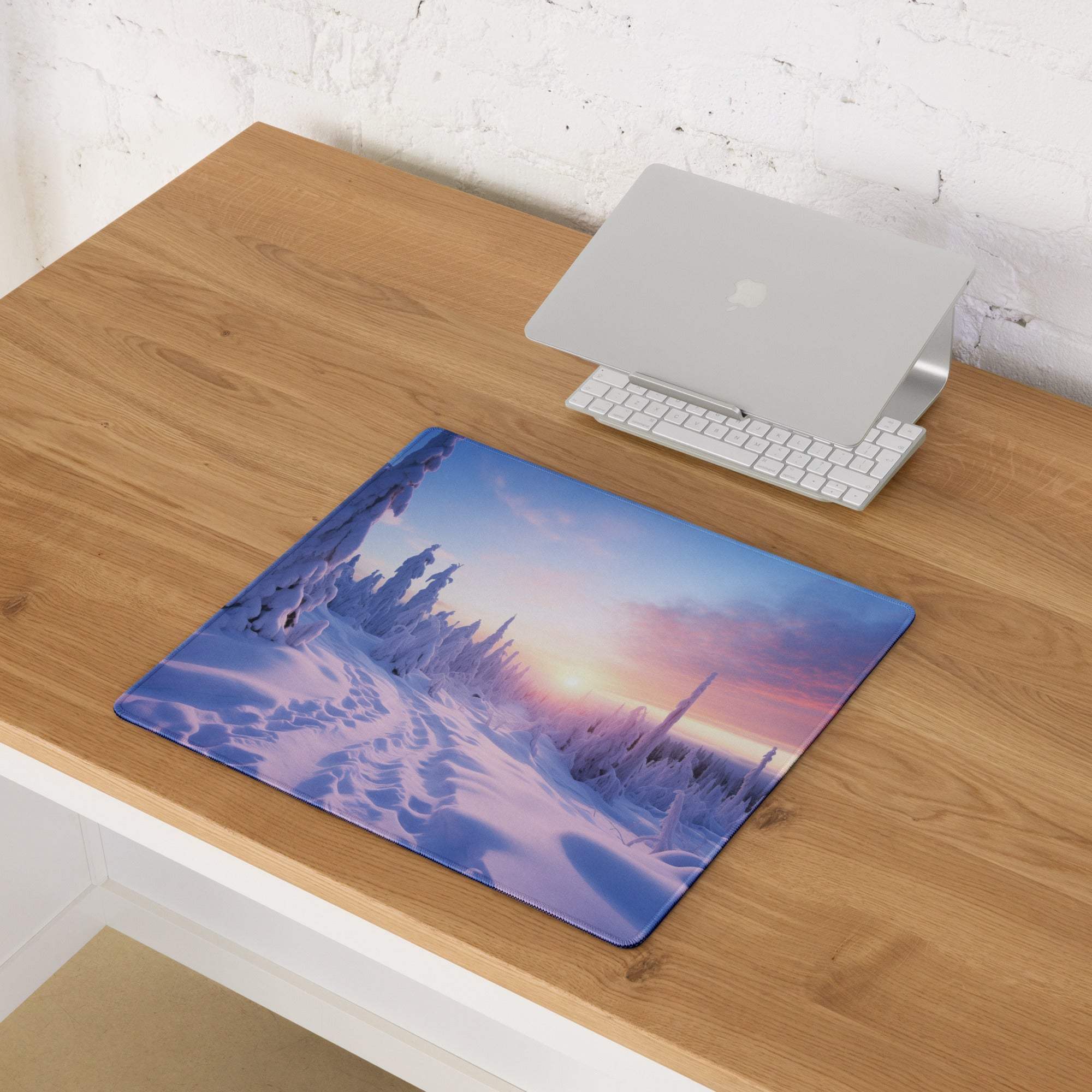 Large gaming mouse pad with icy purple sunset winter landscape and edge stitching