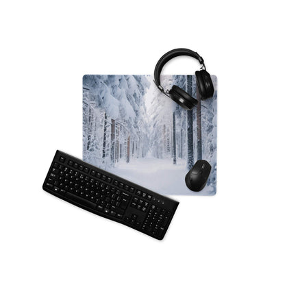 Winter forest gaming mouse pad with black keyboard, mouse, headphones