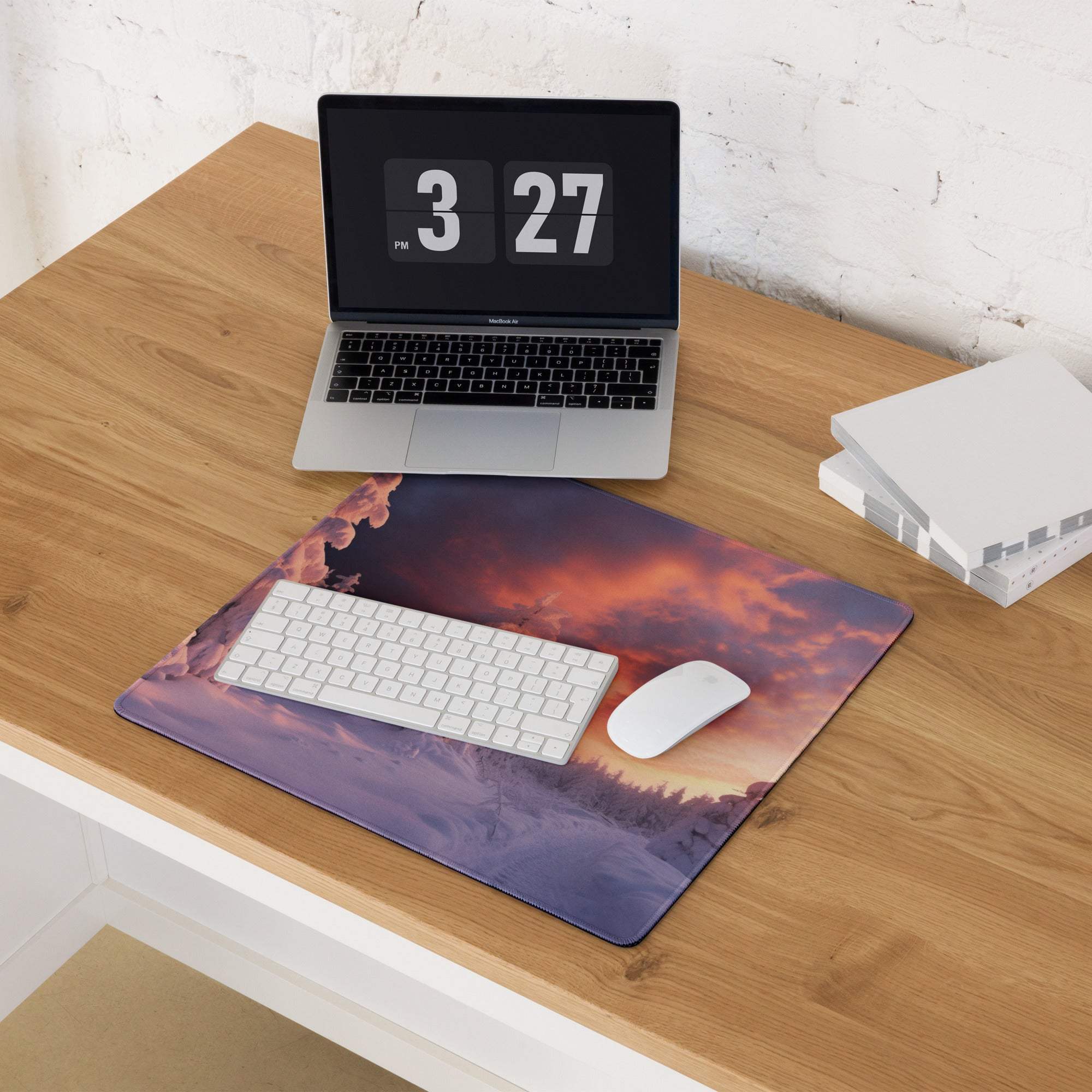 Epic snowy forest at sunset with warm purple orange sky gaming mouse pad
