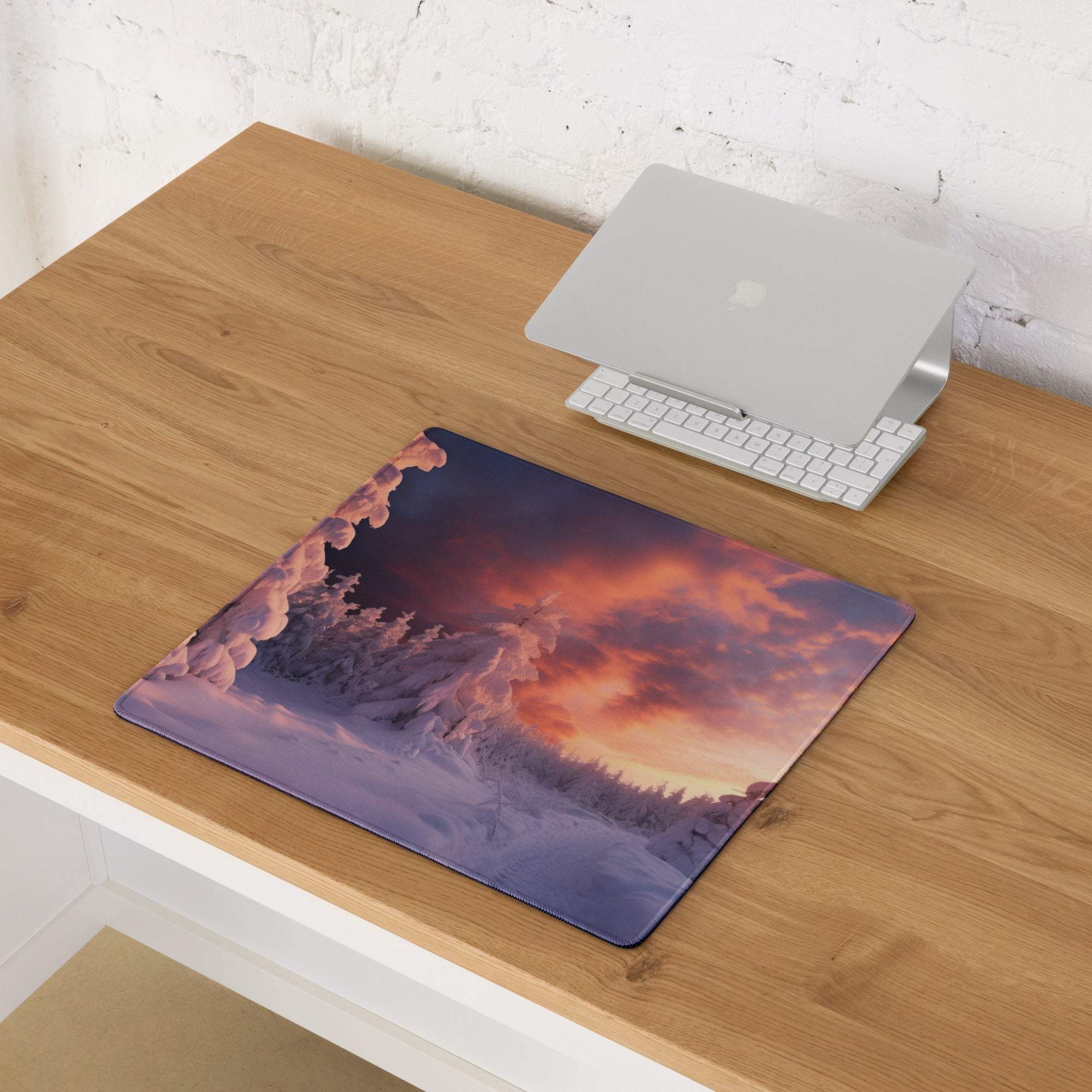Epic snowy forest at sunset mouse pad with orange purple sky