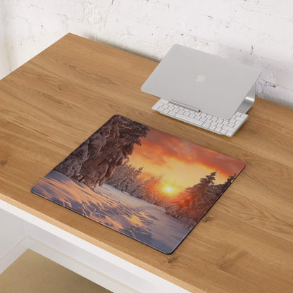 Serene Winter Forest Sunset gaming mouse pad with orange glow and snow trees