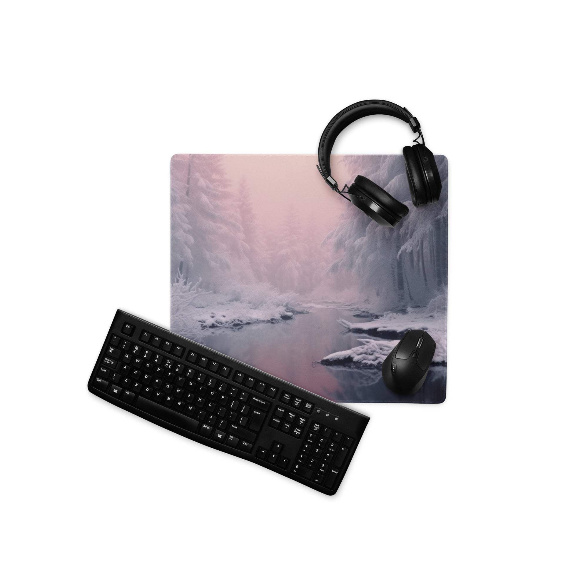 Winter forest pink dawn gaming mouse pad with black keyboard and mouse