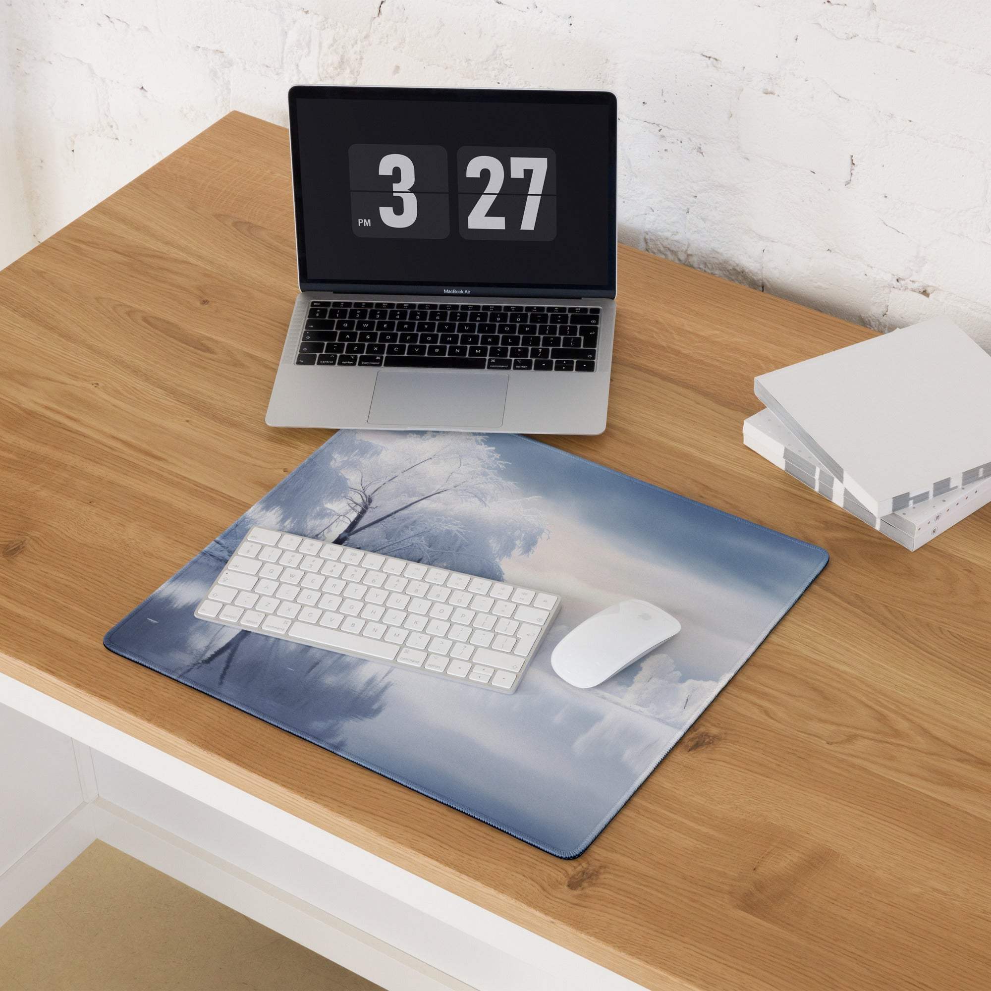 Serene blue and white winter landscape mousepad with frosty tree branches and clouds
