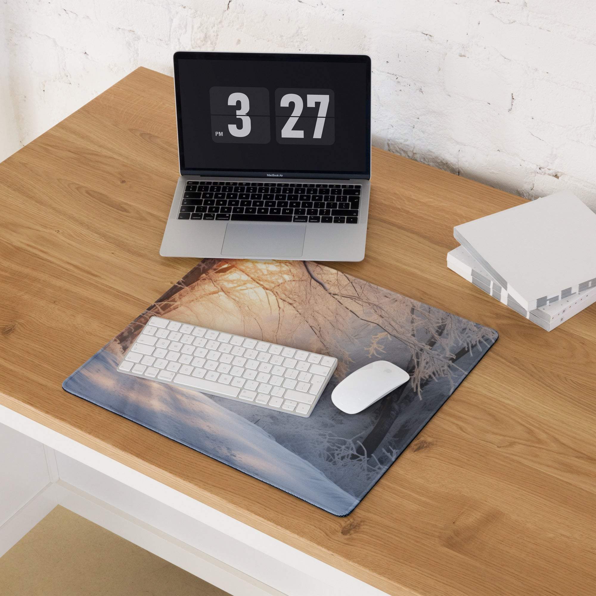Serene winter forest sunrise mousepad with golden glow and bare branches