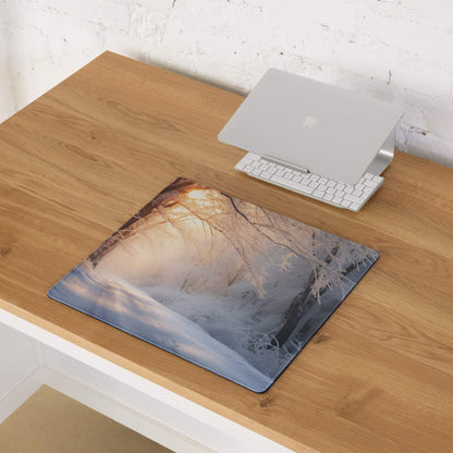 Serene winter forest sunrise mouse pad with golden glow and frosty trees