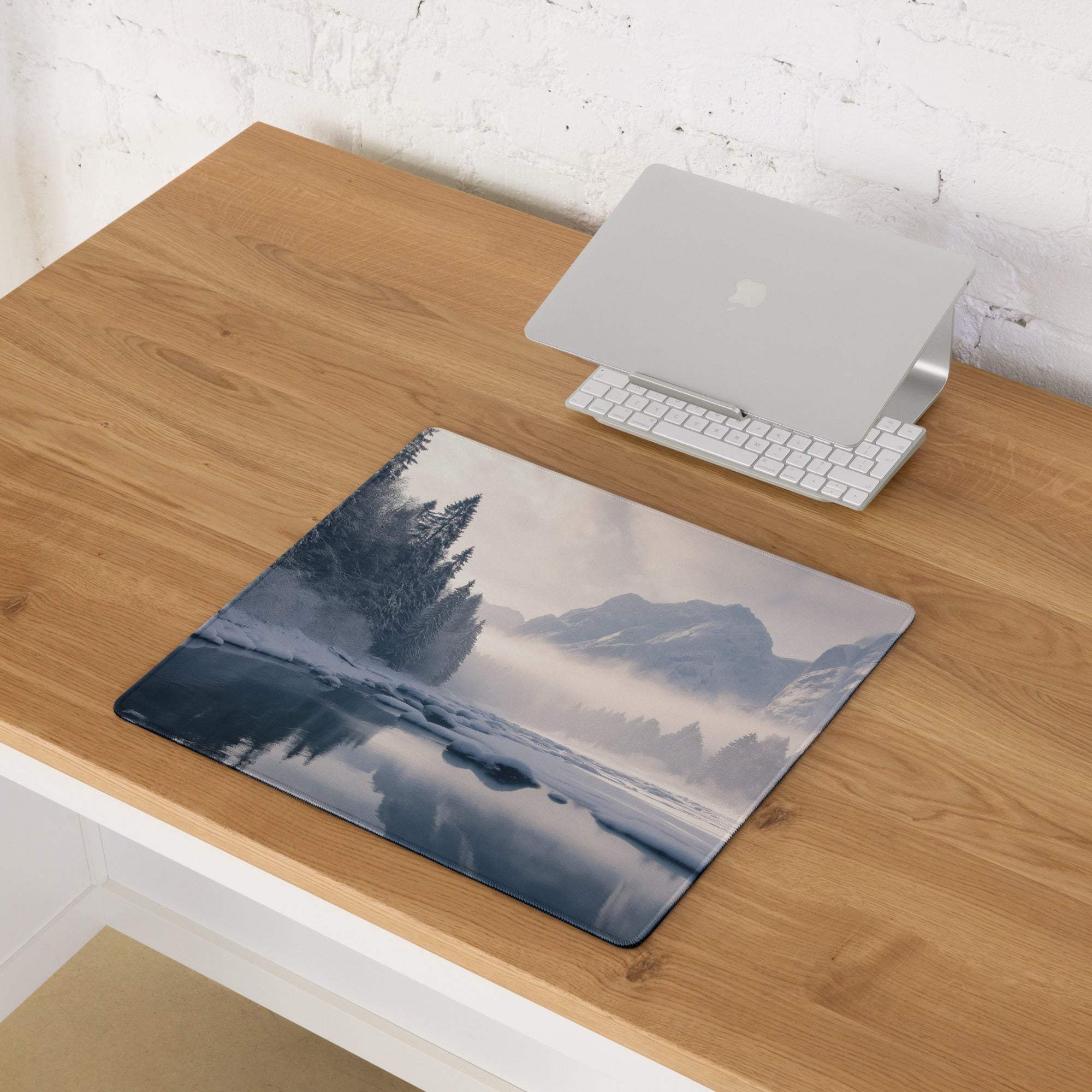Serene winter mountain landscape gaming mouse pad with misty peaks, reflective water, dark evergreens, large size, non-slip backing