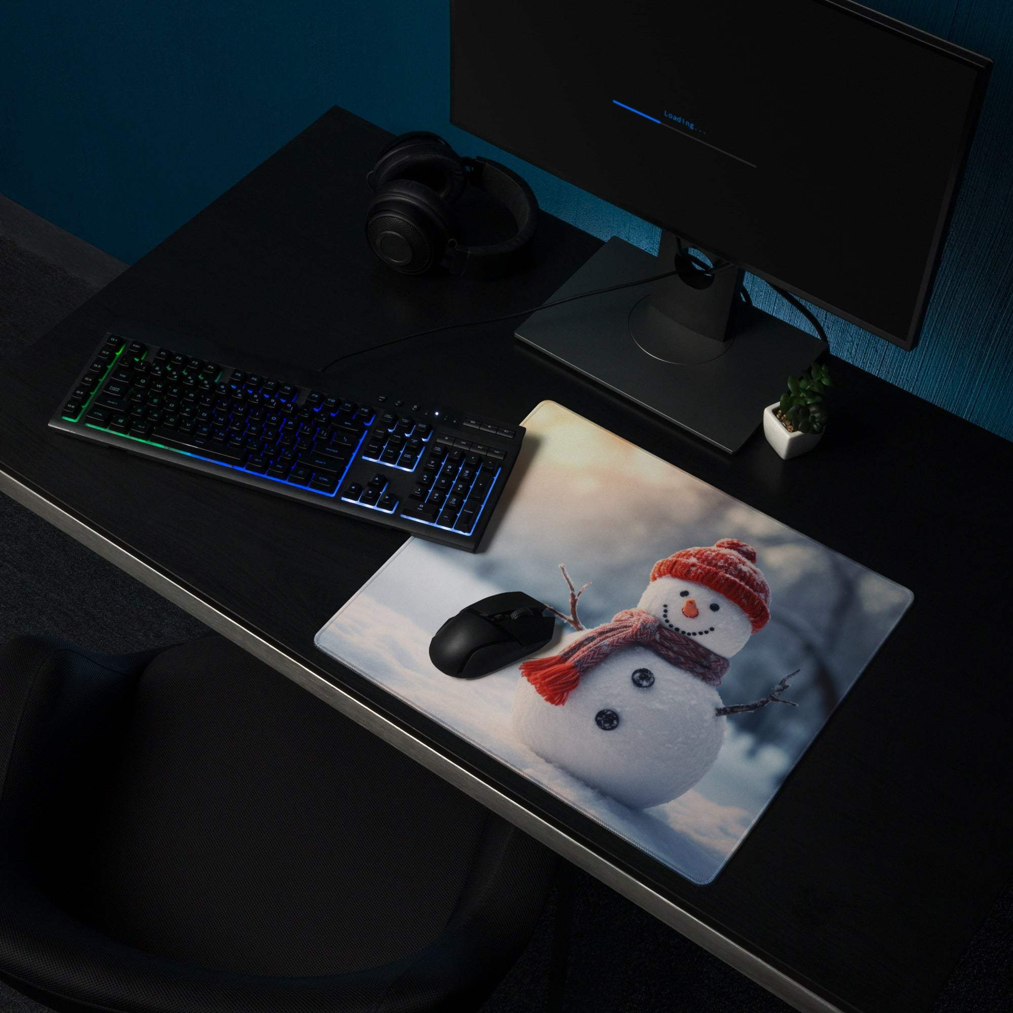 Festive snowman in red hat scarf on large gaming mouse pad