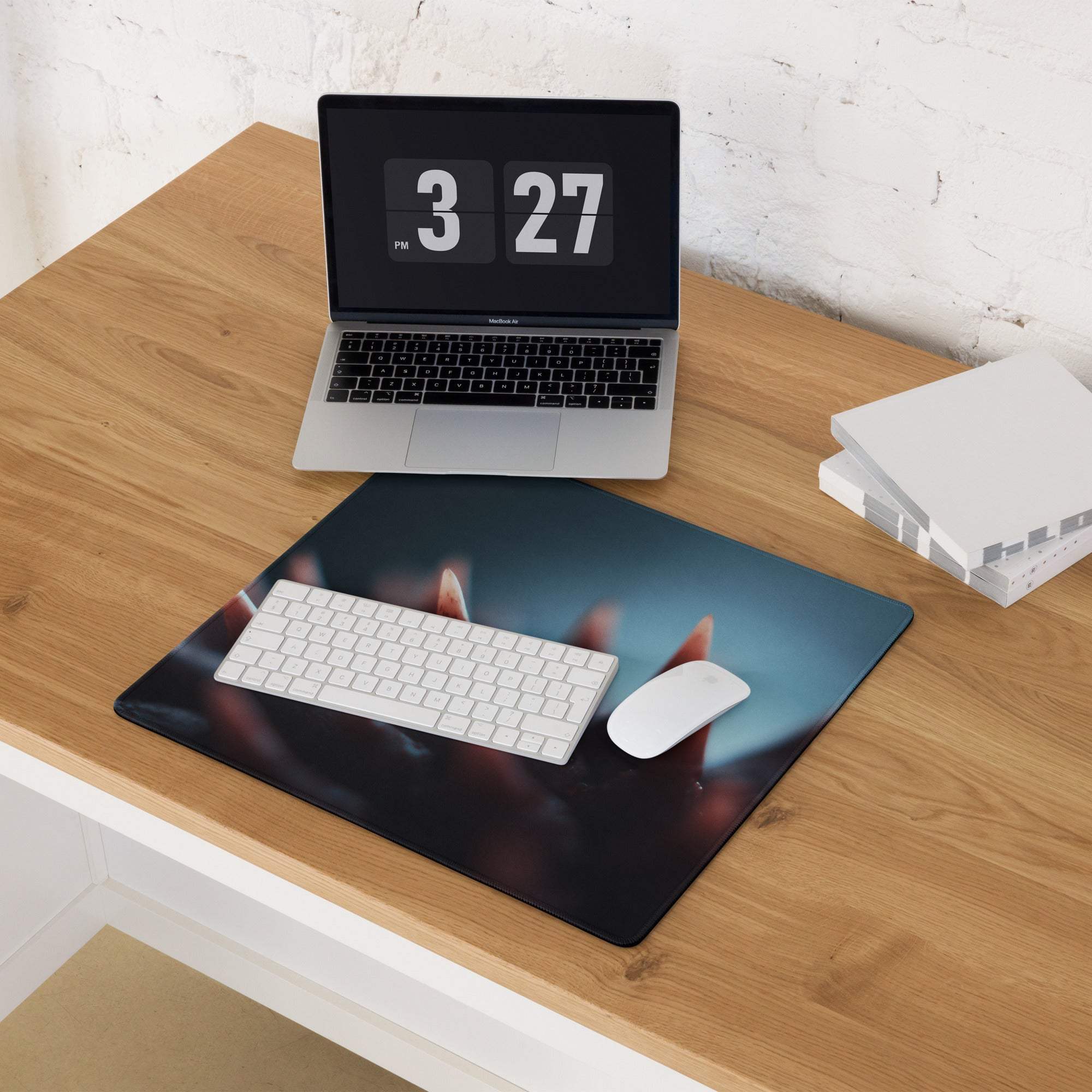 Black rectangular gaming mousepad with moody blue hands reaching up