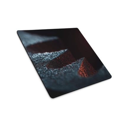 Premium midnight ember gaming mouse pad on glossy black cutting board