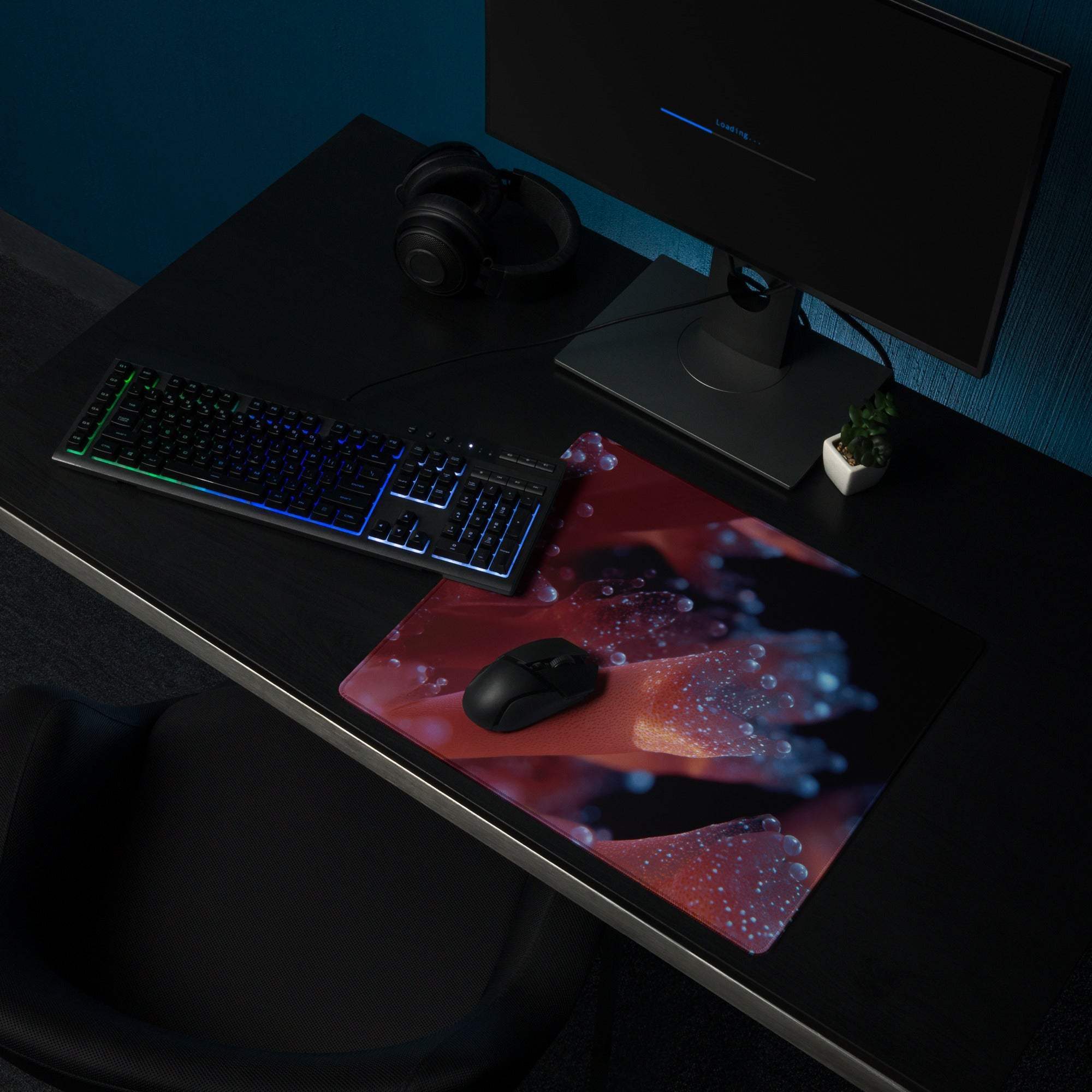 Neon Nebula red black gaming mousepad with glowing blue droplets