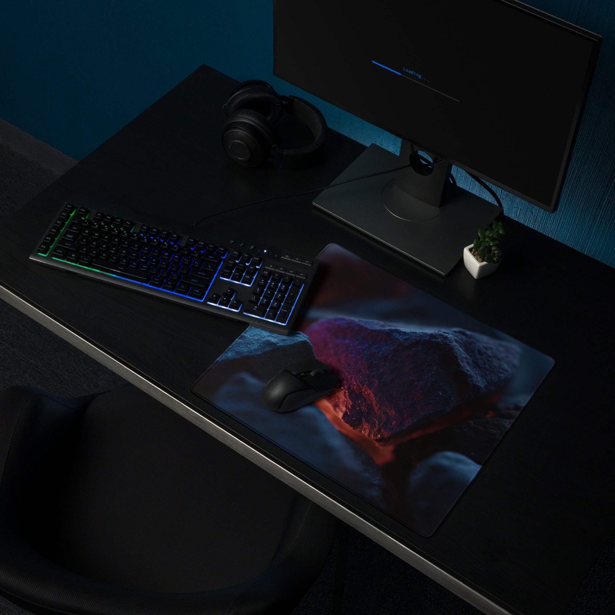 Dark blue neon glow gaming mousepad with erupting volcano lava design