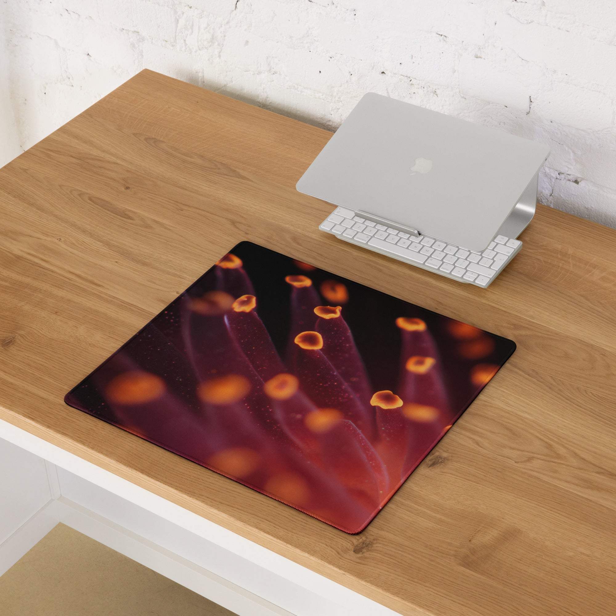 Premium large gaming mouse pad with red orange coral design and purple glow