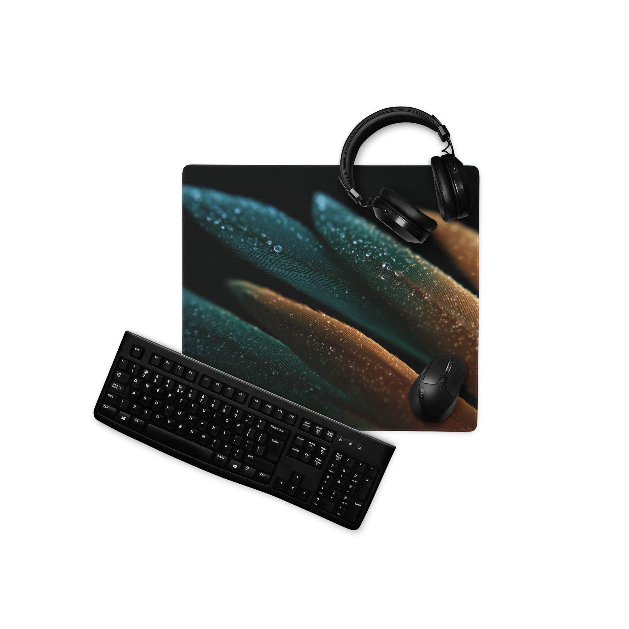 Black ergonomic keyboard on modern teal amber feather gaming mouse pad