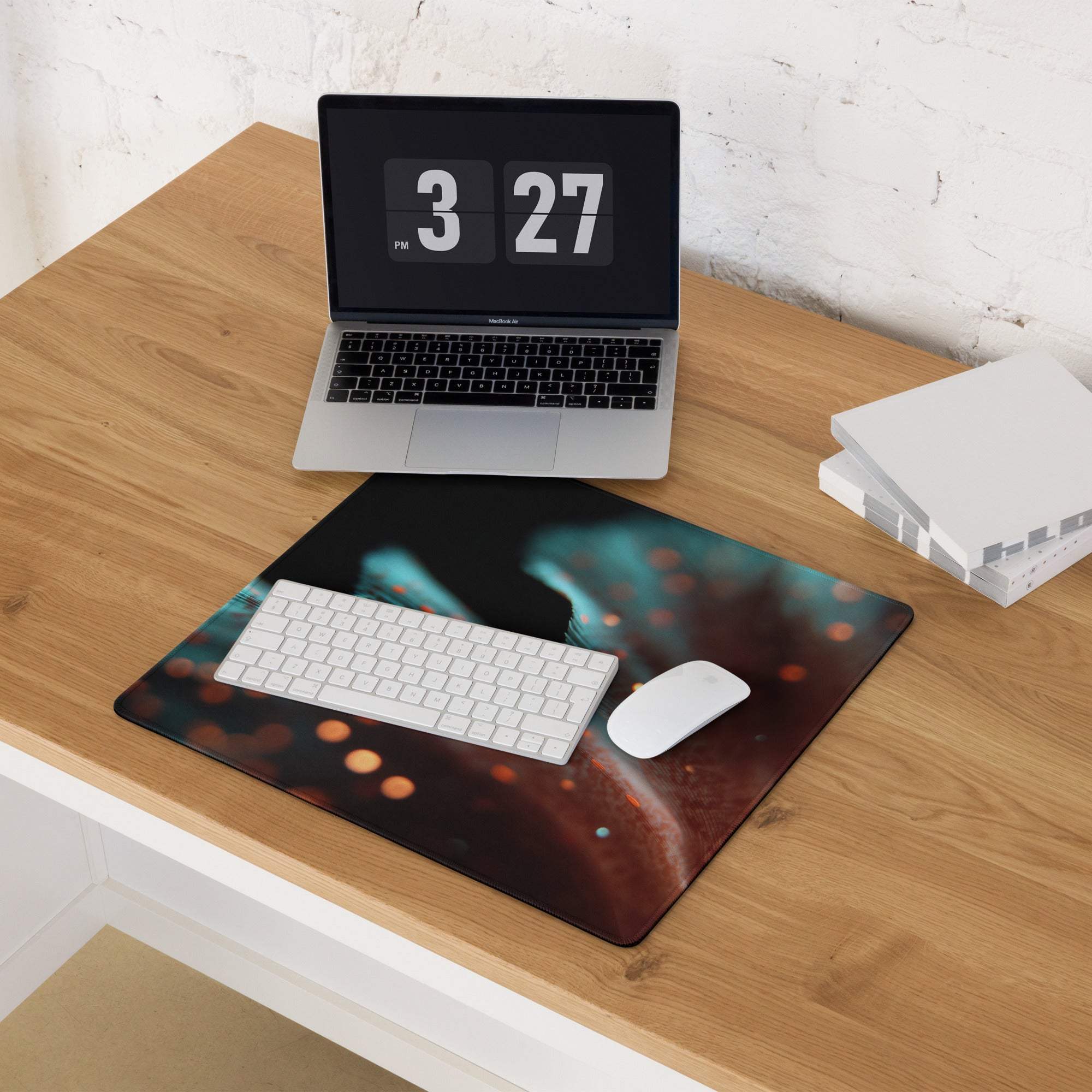 Large extended gaming mouse pad with cosmic nebula design and teal orange glow