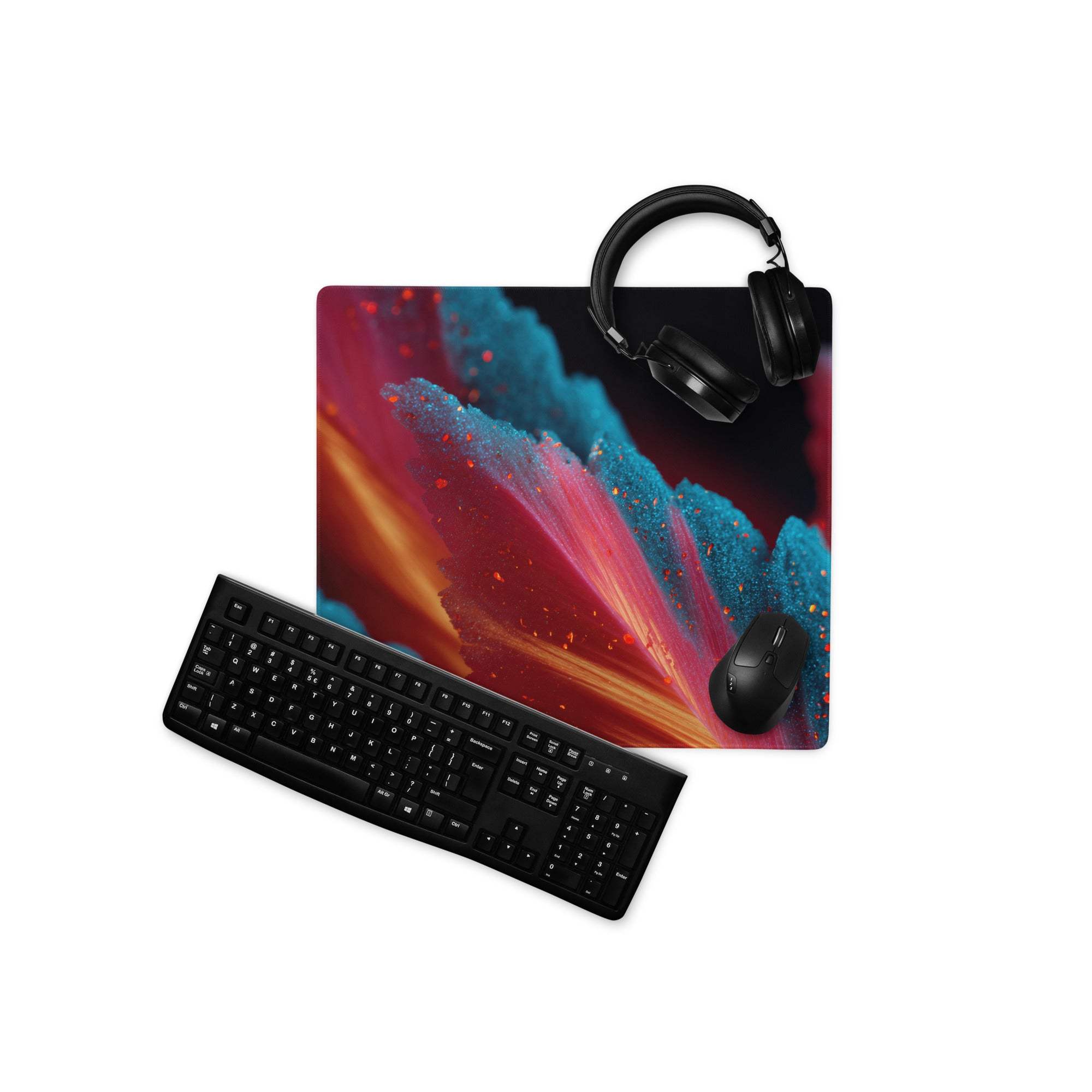 Vibrant cosmic nebula gaming mouse pad with black keyboard and headset