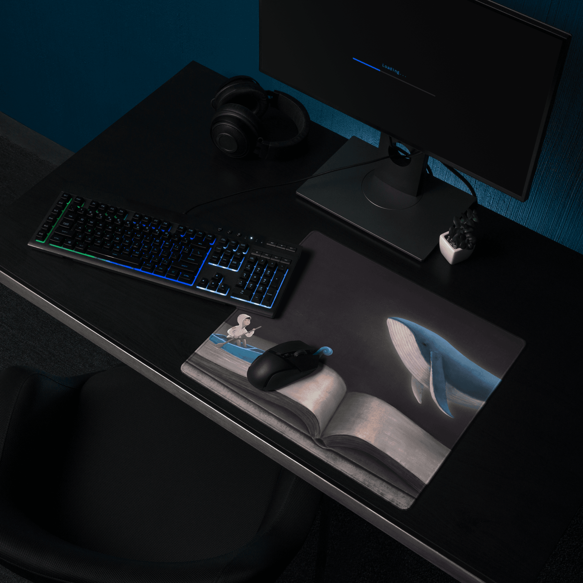 Rectangular blue whale desk scene mouse pad with monochrome open book illustration featuring a whale and small figure