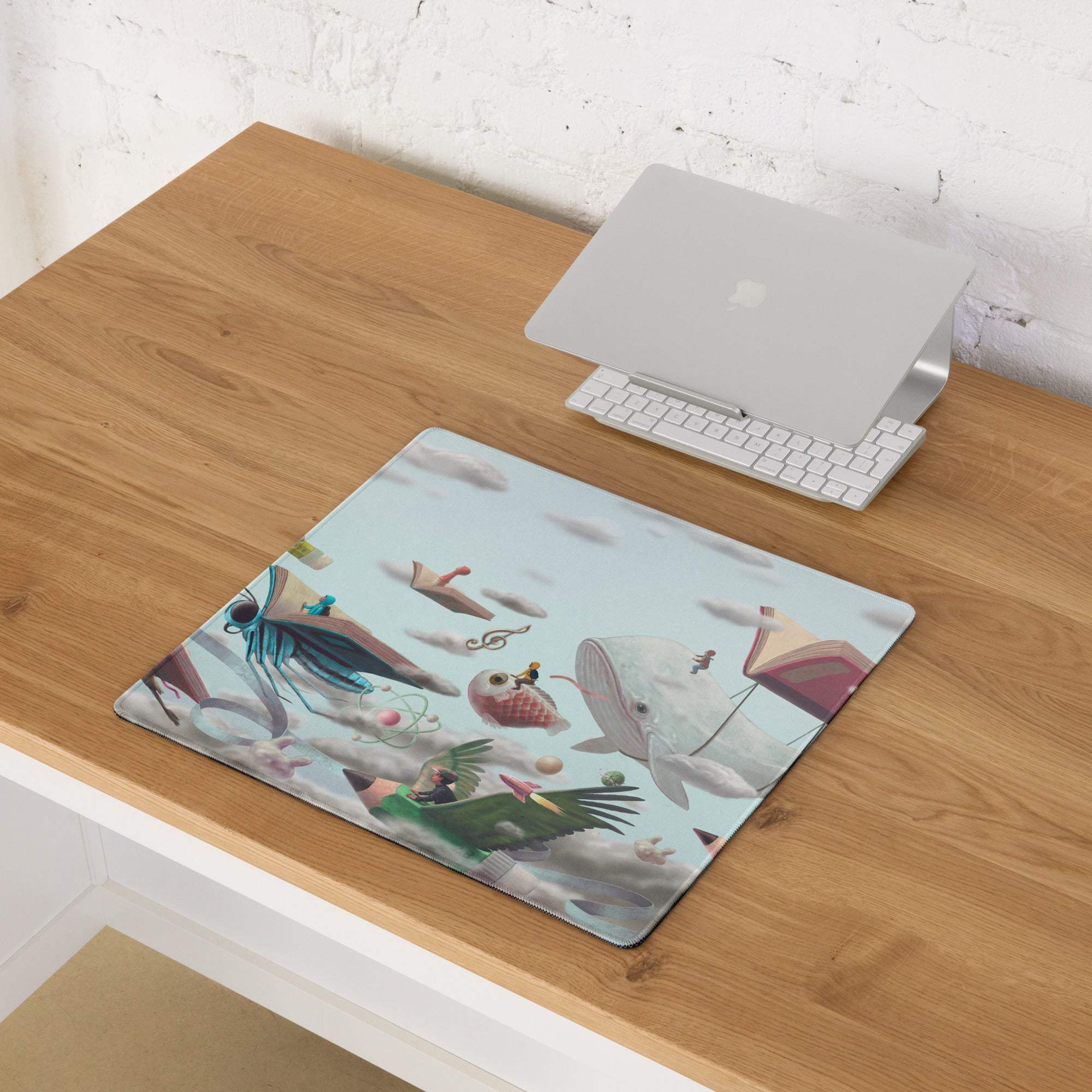 Rectangular surreal sky bookscape mouse pad with whimsical flying animals on light blue desk surface for gaming use
