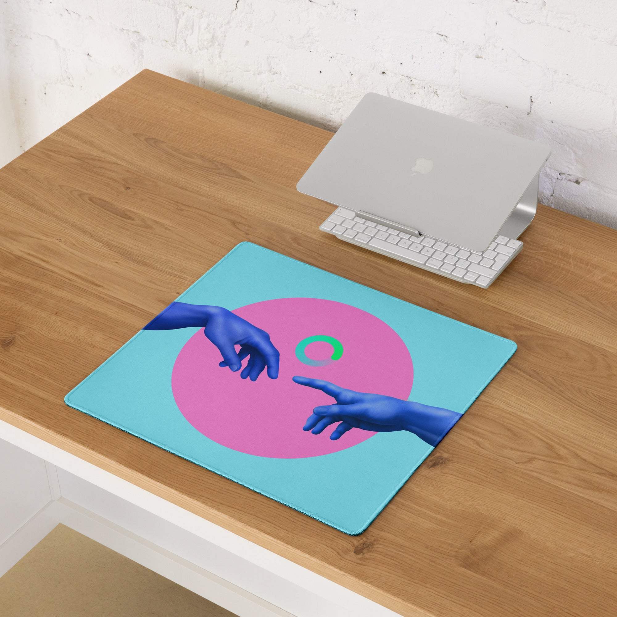 Neon hands abstract pad mousepad in light blue with a vibrant pink circle and blue hands reaching toward a green ring