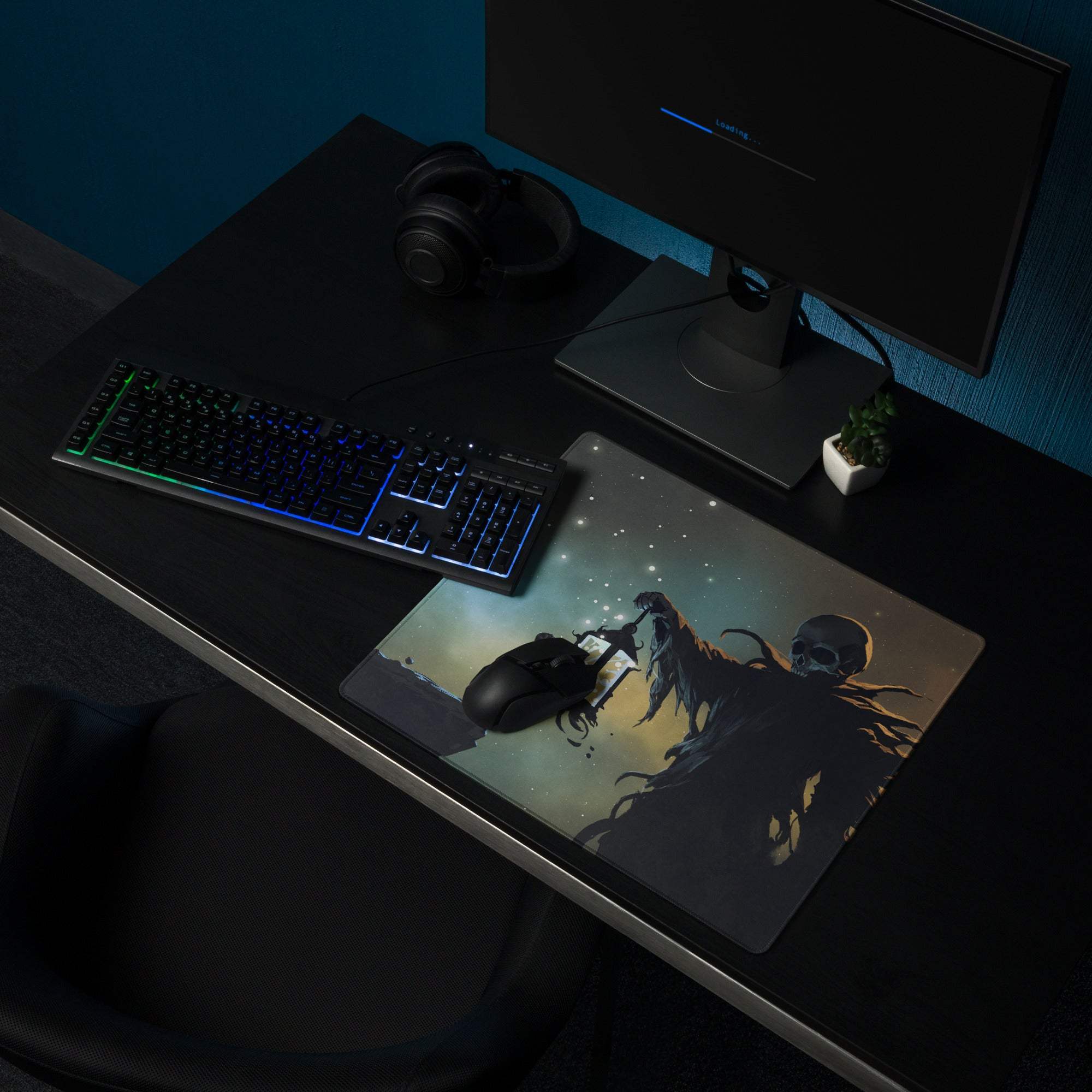 A dark rectangular gaming mousepad featuring a skeletal figure illustration with a starry night sky in blue teal tones