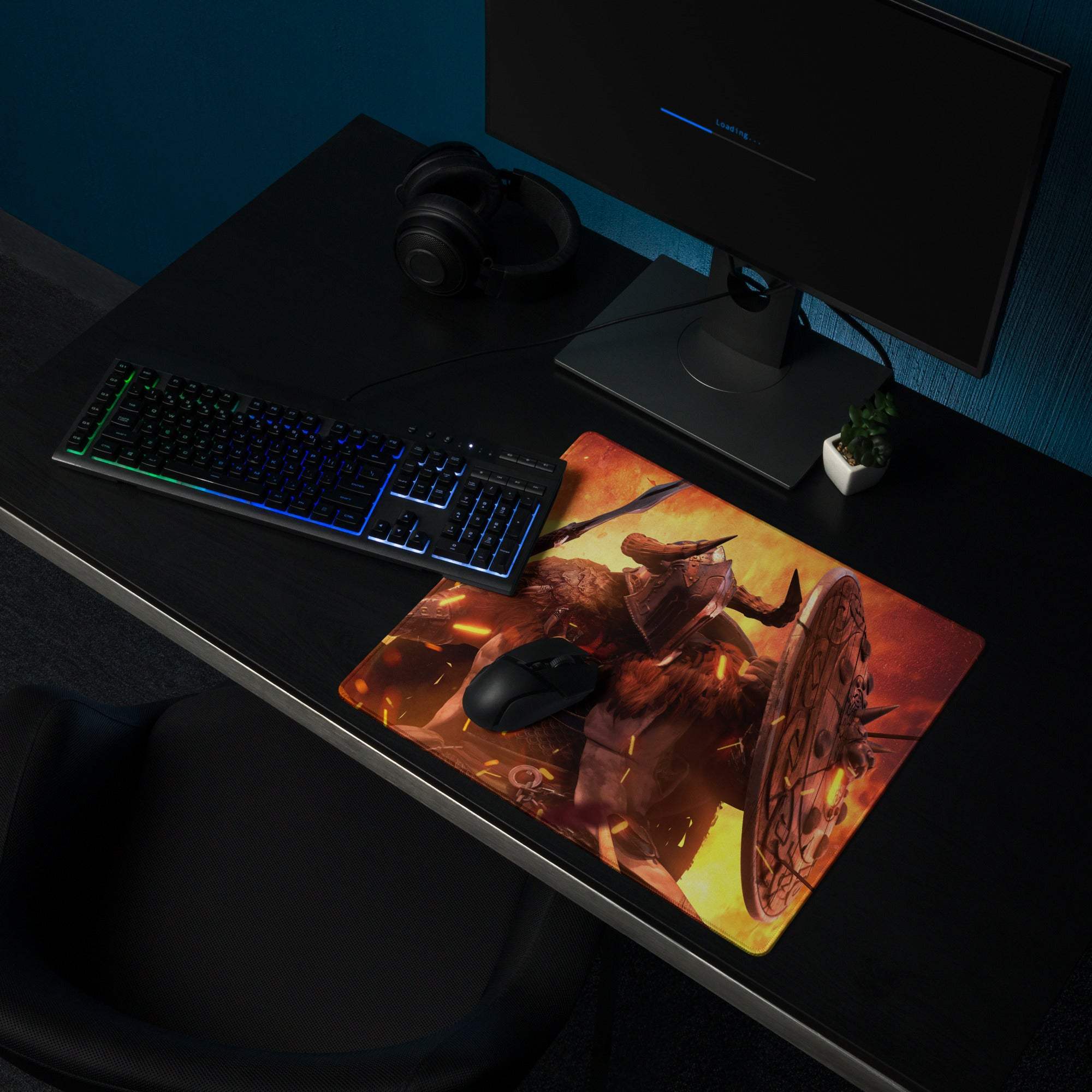 Fiery battle scene gaming mouse pad in vibrant orange and yellow with a horned warrior illustration on a smooth surface