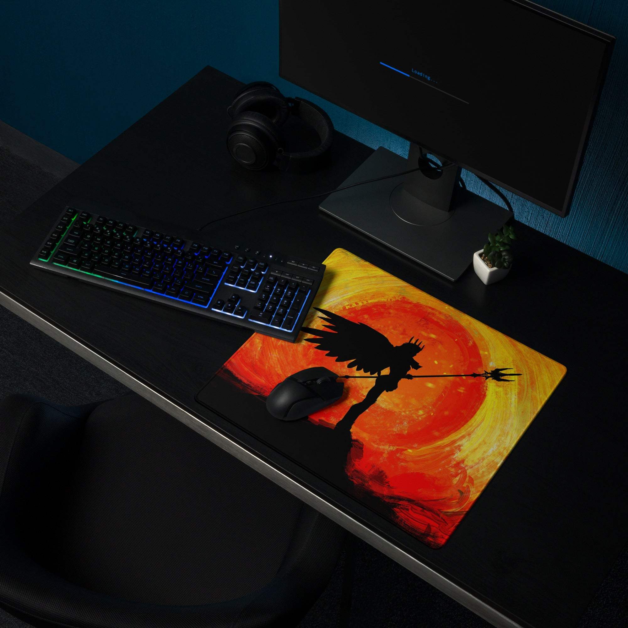 Orange and yellow gradient gaming mouse pad with black angelic silhouette and spear against fiery sun backdrop