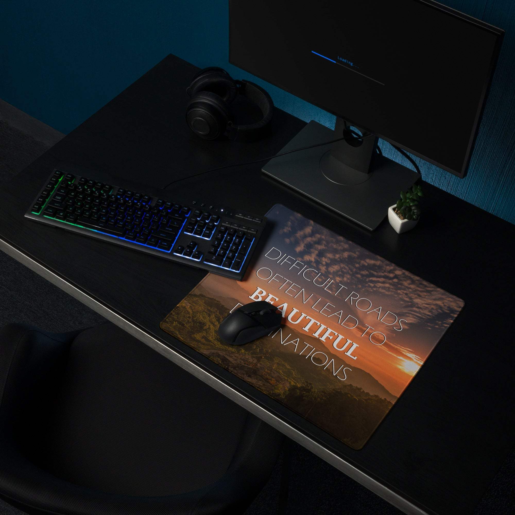 Rectangular polyester mousepad with warm sunset landscape and white text difficult roads often lead to beautiful nations