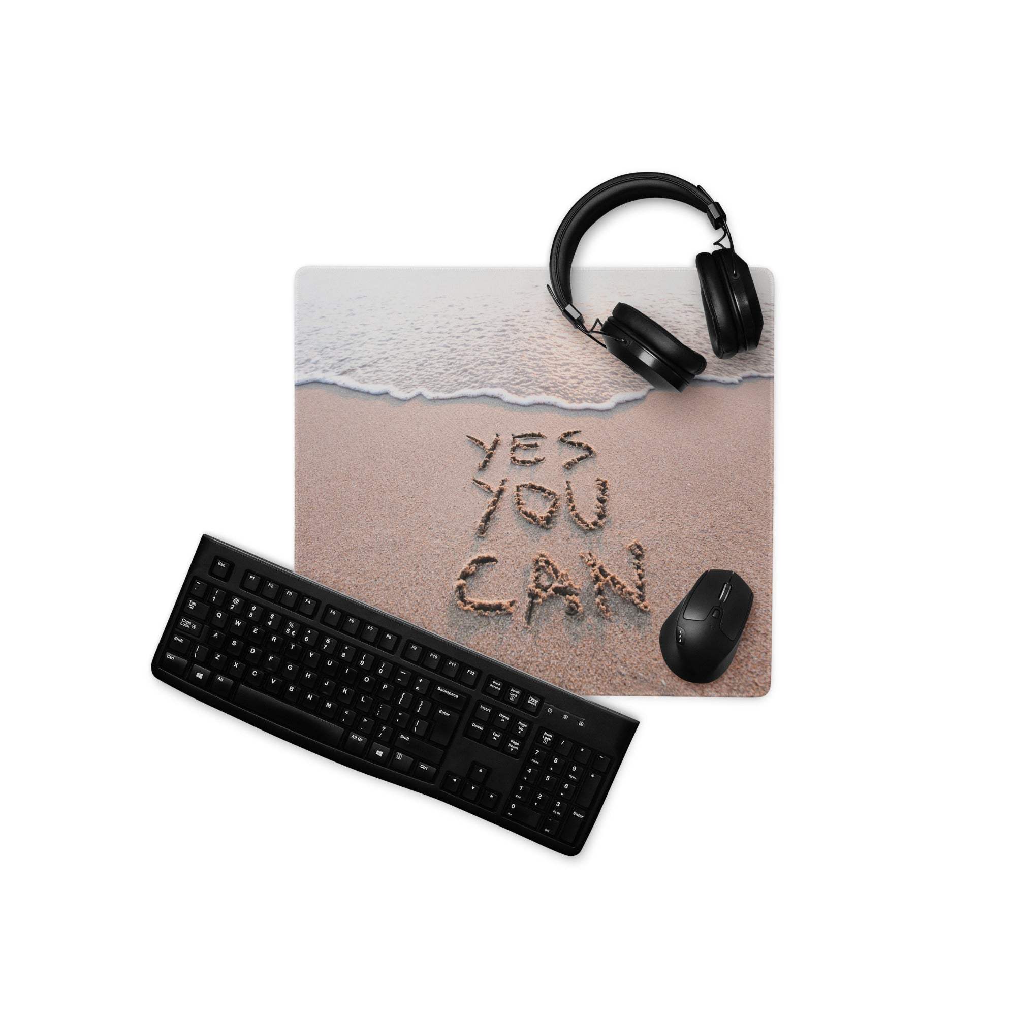 Beige sand ocean blue large non slip mouse pad with yes you can beach theme design and black headphones on top
