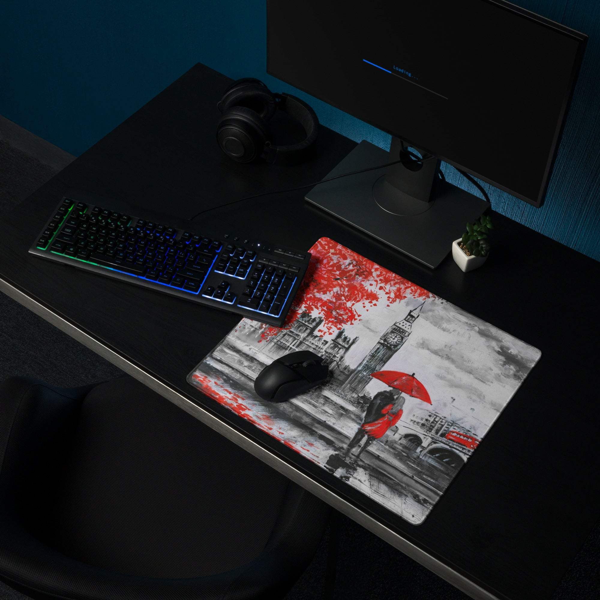 Rectangular london cityscape mousepad with black and white illustration and red accents featuring big ben and umbrella