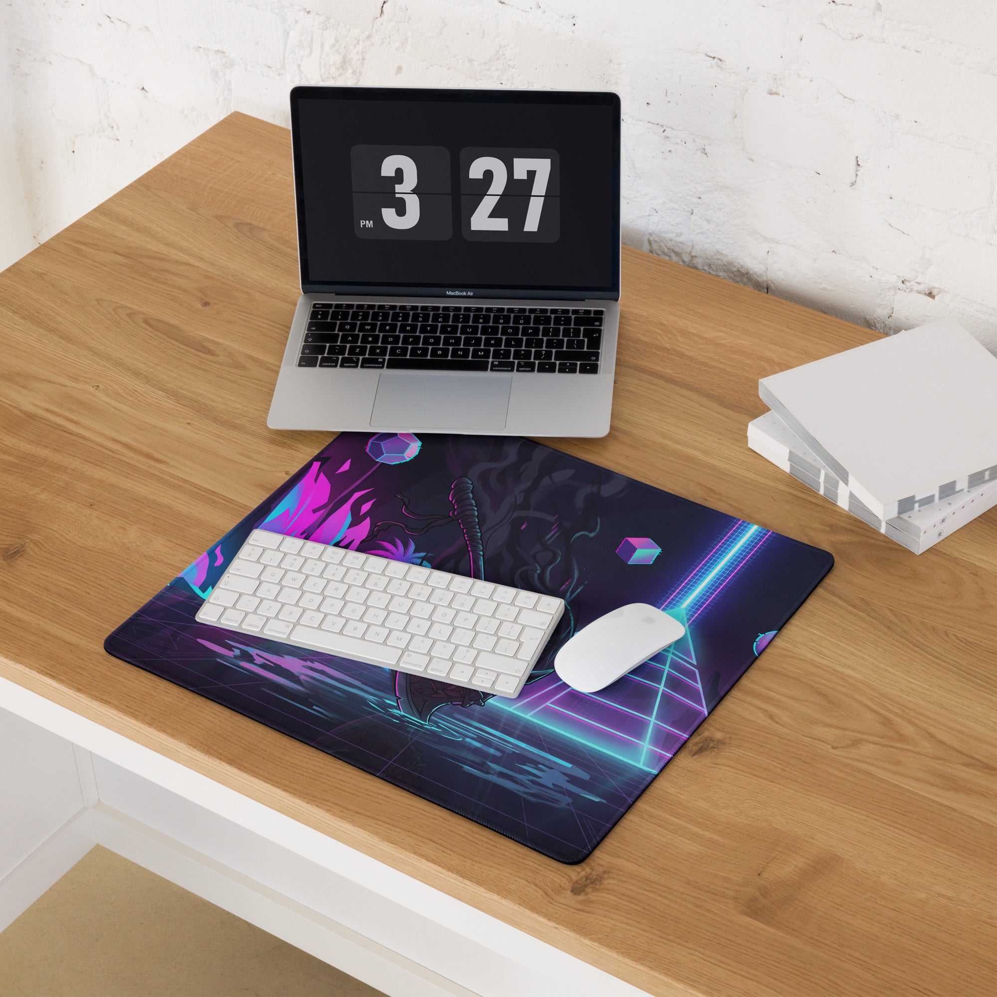 Narrow rectangular gaming mouse pad with neon pink purple blue cyberpunk graphics on dark purple and black background
