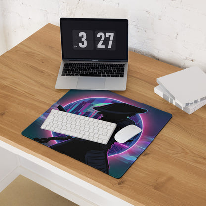 Neon vaporwave gaming mouse pad in navy blue and purple with a neon pink hooded figure silhouette and glowing backdrop