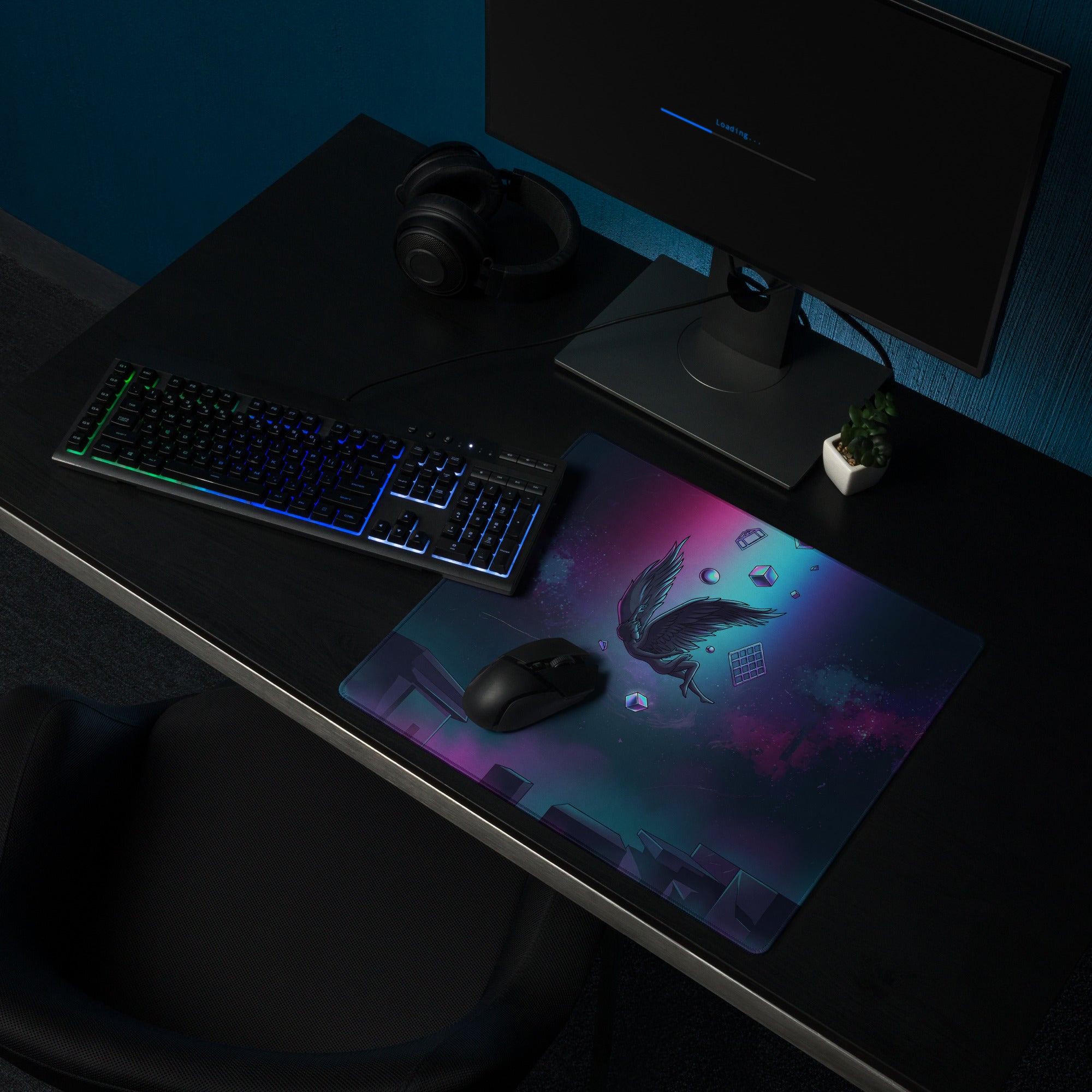 Vibrant galaxy-themed gaming mousepad with black winged creature and glowing purple and teal cosmic elements