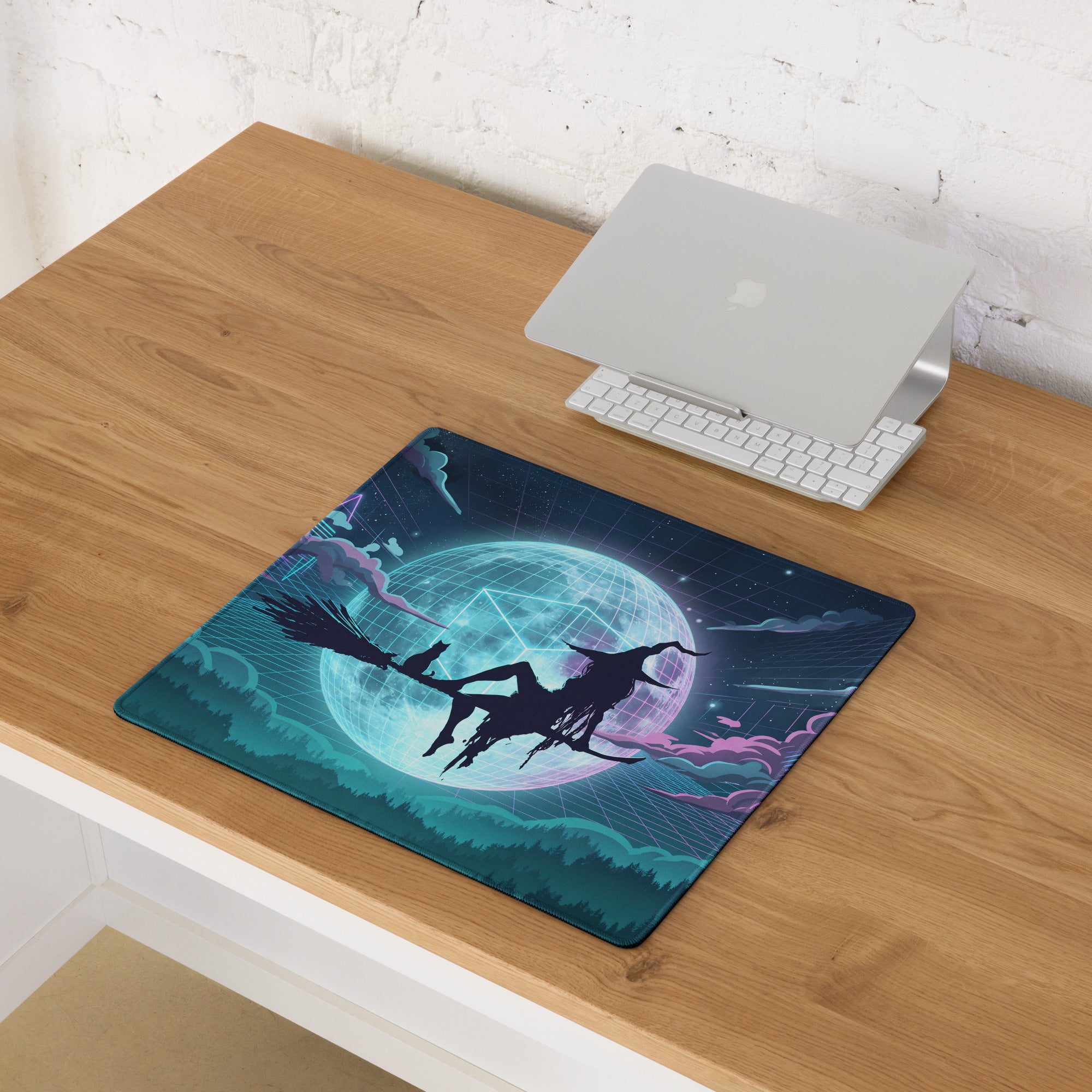 A dark teal vaporwave mouse pad with a neon stylized witch riding a broomstick against a glowing blue moon