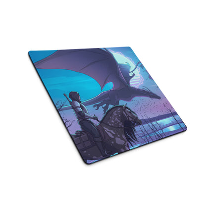 A square gaming mousepad with vivid blue and purple neon artwork of a knight on horseback facing a dragon under twilight