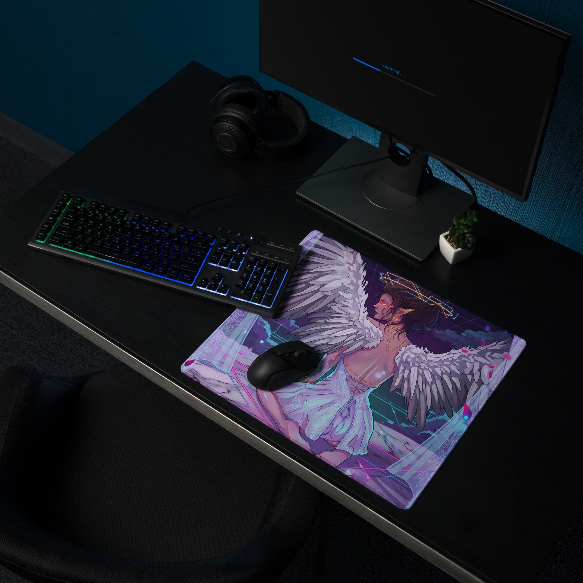 Rectangular gaming mousepad with vibrant vaporwave angel wing design in neon pink and blue for a gaming desk setup