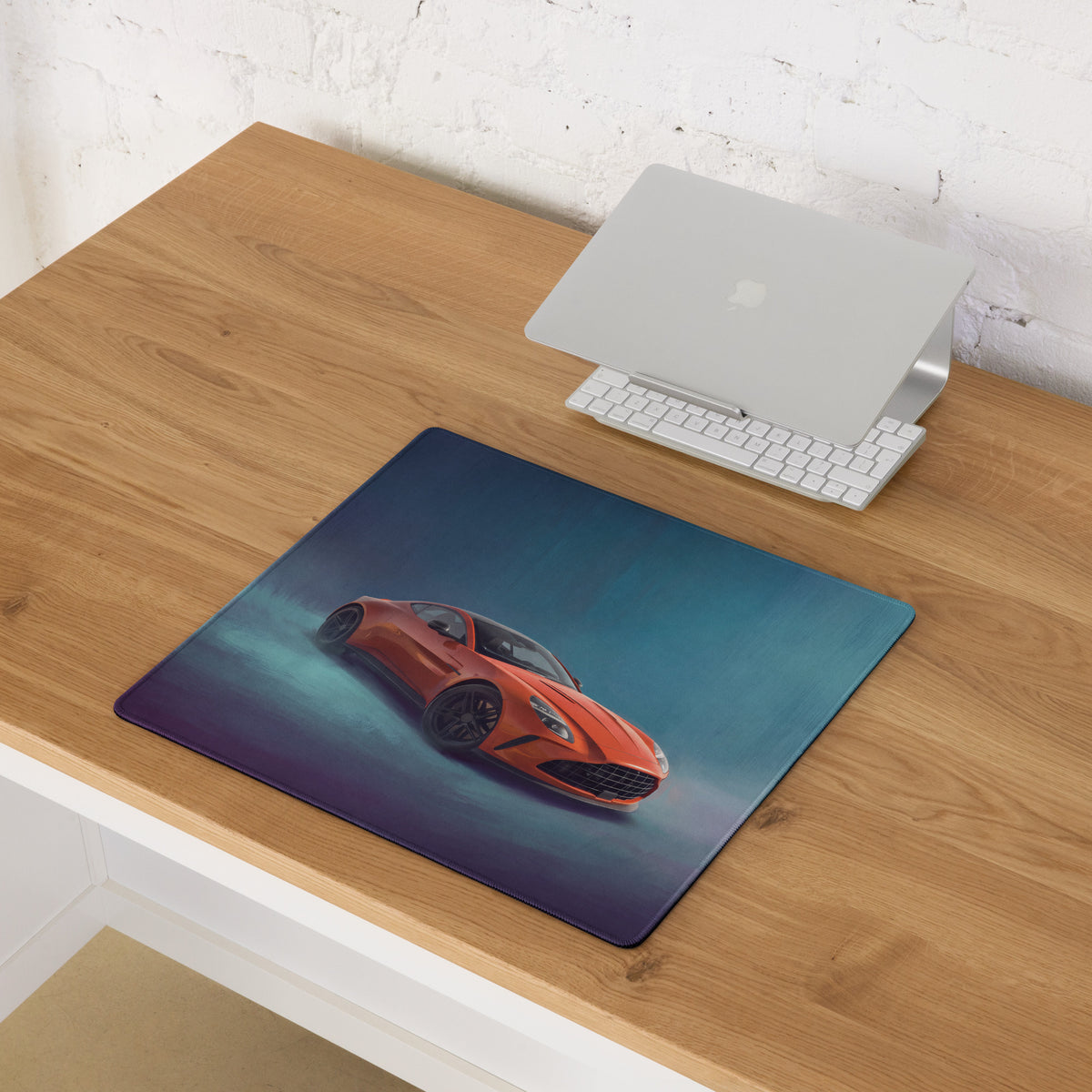 Rectangular xl gaming mousepad with vibrant orange Aston Martin vantage sports car on blue purple gradient background