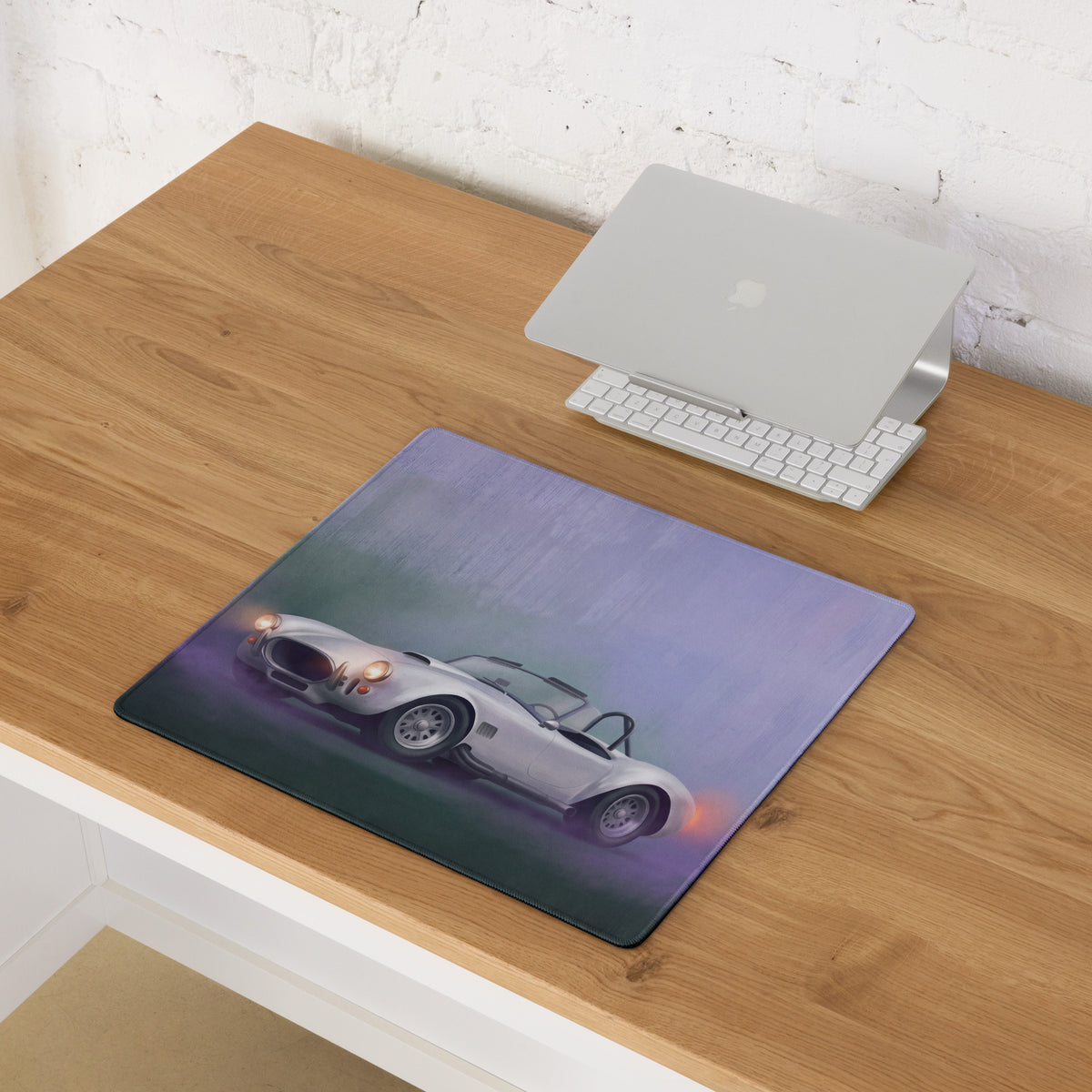 Shelby Cobra inspired pearl white extended non-slip desk pad with silver classic sports car illustration and purple gradient background
