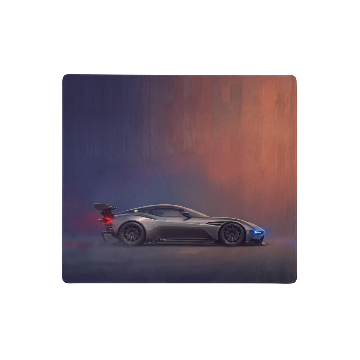 A charcoal stealth desk pad featuring a matte black aston martin valkyrie design with ultra-glide stitched edges for gaming