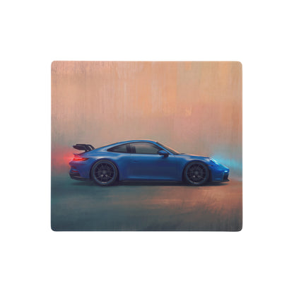 Blue porsche 911 sports car printed on a wooden plaque featured on a porsche 911 gt3 inspired shark blue desk pad