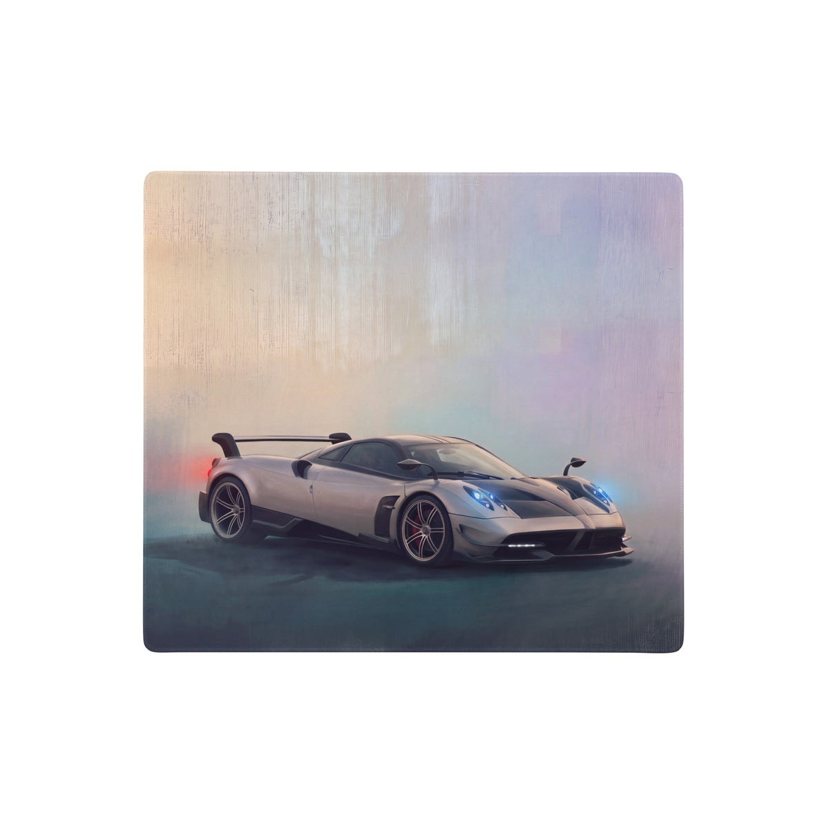 Silver pagani huayra inspired extended non slip desk pad with sleek sports car design and glowing blue headlights