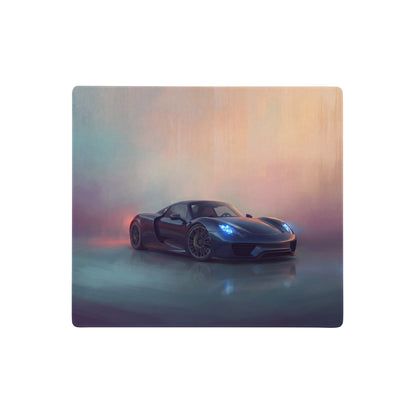 A sleek black Porsche 918 Spyder with glowing blue headlights on a midnight blue extended non-slip desk pad