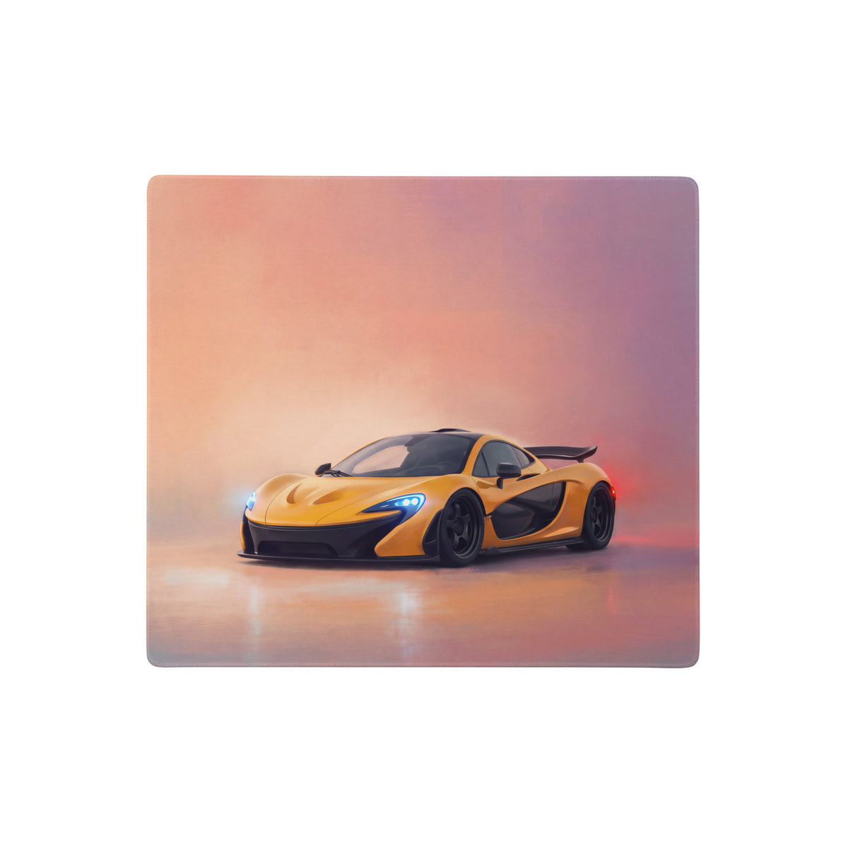 Vibrant yellow McLaren P1 inspired solar flare desk mat made of low-friction cloth with a sports car graphic