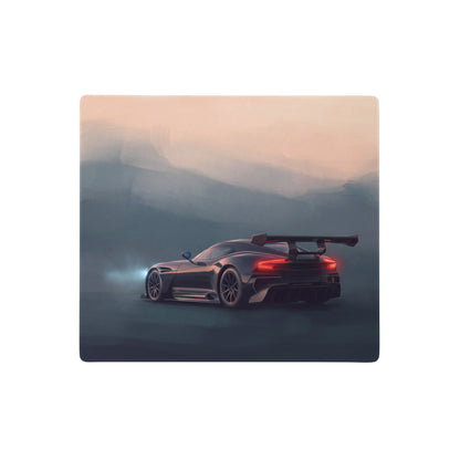 Black aston martin vulcan inspired onyx track desk mat with rear spoiler and glowing taillights on low friction cloth mousepad