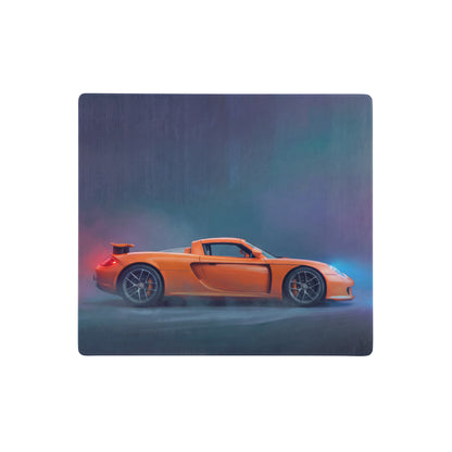Vibrant orange porsche cayman sports car side profile on a smooth high dpi porsche carrera gt inspired desk mat