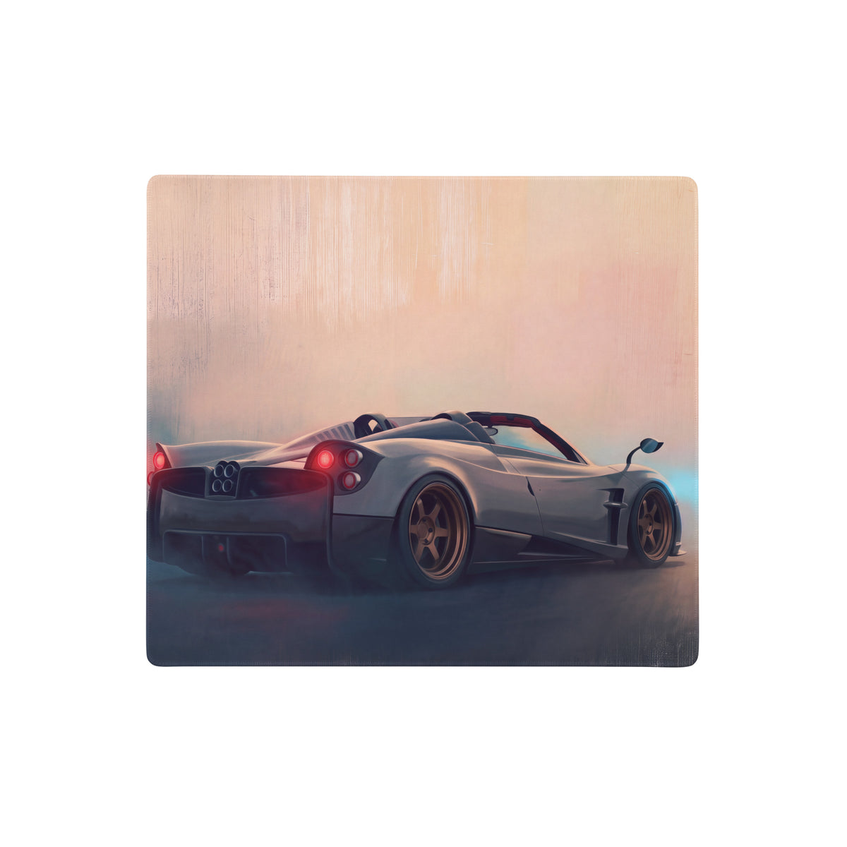 Silver pagani huayra convertible with gold rims on rectangular wooden non-slip rubber gaming mousepad