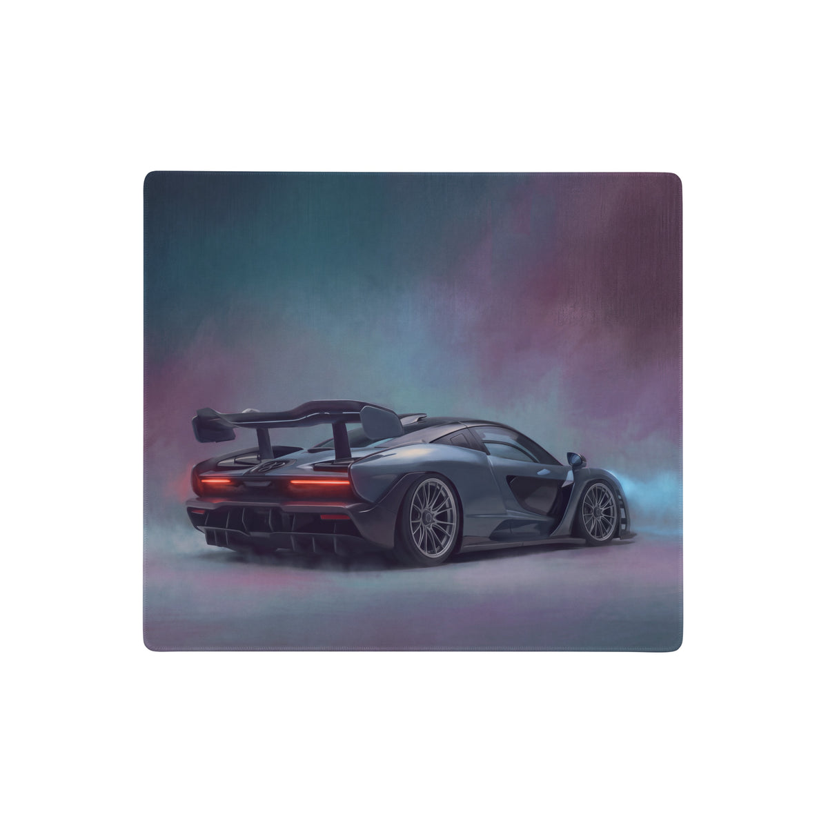 A sleek matte black mclaren senna inspired apex stealth desk pad with glowing red taillights and smoky background hues