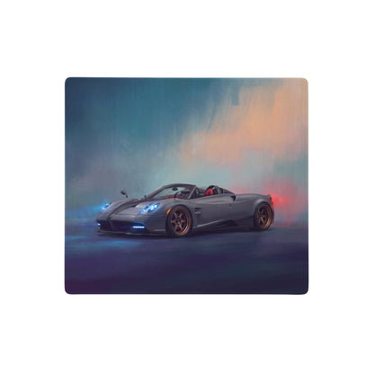Stylized gray pagani huayra roadster with blue headlights and bronze wheels featured on gold leaf stitched edge desk pad