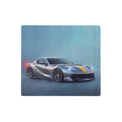 Silver ferrari 812 superfast with yellow racing stripes and black rims on a giallo desk pad with non-slip base