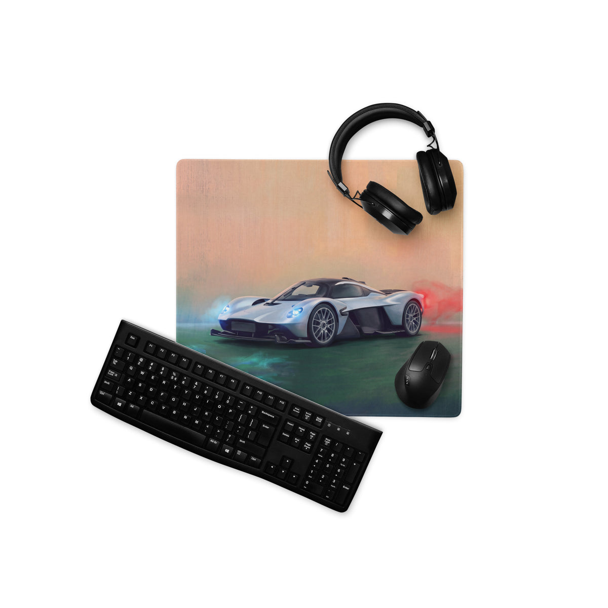 Aston Martin Valkyrie inspired aero edition desk mat with silver and black sports car graphic on a low-friction surface