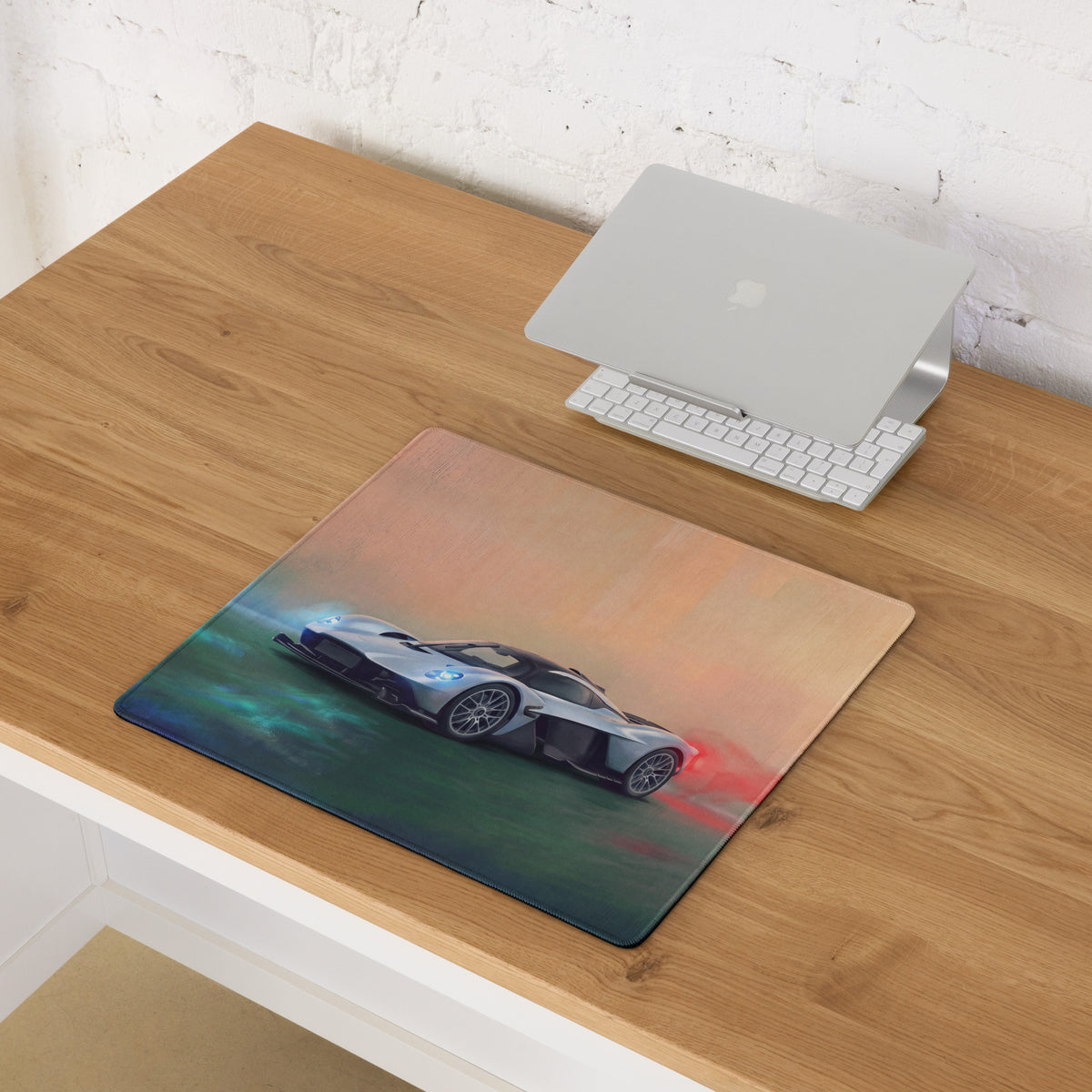 Aston Martin Valkyrie inspired aero edition low-friction gaming mousepad with a silver sports car and vibrant graphic